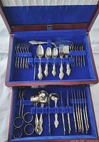 Chest open showing both tiers of cutlery assortment