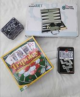 Group shot showing Tripoley, backgammon box, 5 Classic Games tin, dominoes tin