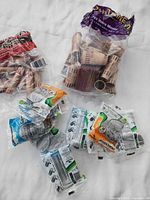 Group shot showing paper wrapper bags and multiple sealed Cascades Plastichange plastic wrapper packs