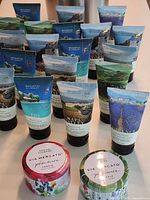 Group of hand creams with both candles in foreground