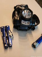 Headlamp, mini flashlight, Brookstone multi-tool grouped