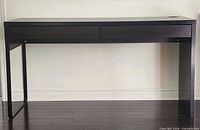 Full frontal view of IKEA MICKE desk showing two drawers, legs and overall structure