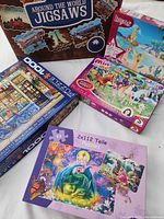 Five puzzle boxes showing titles and themes