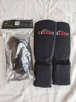 Front view of both pairs showing Nike Charge package and Exeedo guards