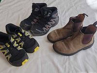 All three pairs of shoes side by side on white background