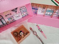 Overall lot: playset, two dolls, two visible watches