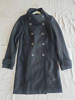 Front view of French Connection black double-breasted coat, full length