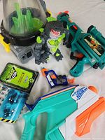 Beast Lab chamber, shark figure, instruction booklet, sticker sheet, cards and four blasters laid out