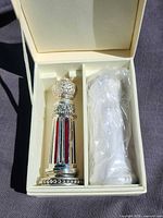 Bottle and sealed vial inside presentation box