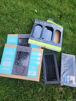 All boxed and wrapped floor registers laid on grass