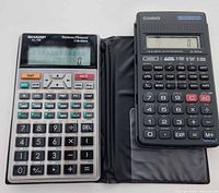 Sharp EL-738 with case and Casio fx-350HB powered on side by side