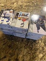 Stacks of 2021-22 Upper Deck hockey cards bundled together