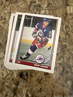Stack of O-Pee-Chee hockey cards, top card Brent Ashton Winnipeg Jets