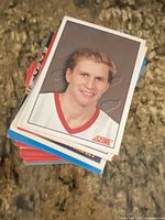Stack of hockey trading cards with Score card on top