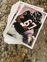 Stack of Fleer football cards with Atlanta Falcons player card on top