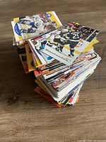Stack of assorted hockey trading cards on table