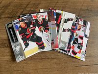 Stack of Ottawa Senators trading cards fanned slightly to show front designs