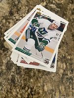 Stack of Upper Deck hockey cards, top card showing Hartford Whalers player