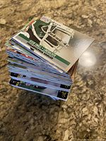 stack of assorted football cards, top card Jesse Small Philadelphia Eagles