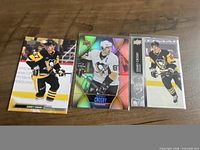 All three Sidney Crosby trading cards laid out front side visible