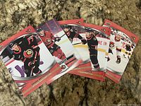 Fanned layout of five of the six Ottawa Senators 2022-23 Upper Deck cards showing Batherson, Stützle, Kubalik and two additional players