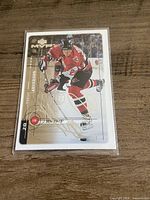 Front of Magnus Arvedson signed Upper Deck MVP hockey card in sleeve