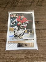 Front view of autographed Ron Tugnutt trading card in plastic sleeve