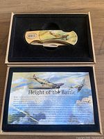 Knife in presentation box with information card visible