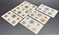 All six uncirculated coin sets laid out showing cardstock side