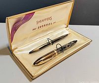 Open Sheaffer case displaying fountain pen and mechanical pencil