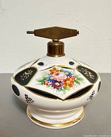 Full view of round porcelain perfume atomizer