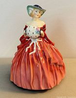 Full view front of Genevieve figurine showing gown and stance