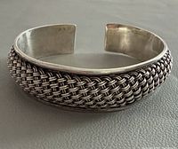 Perspective view of entire cuff showing woven center and open ends