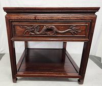 Front view showing entire table and carved drawer