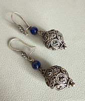 full view of both earrings showing design and length