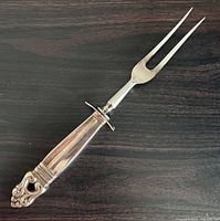 Full view of carving fork, handle detail visible