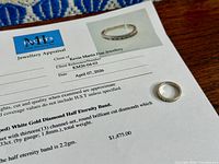 Appraisal document with ring showing metal colour and diamond setting