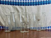 Group shot of all nine embossed milk and cream bottles