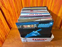 Box holding vertical stack of LPs with Starlight Express frontmost