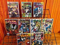 Full lot of nine Venom-related comics on rack