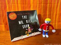 Book and figurine together front view