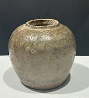 Front view of stoneware ginger jar showing overall shape and glaze