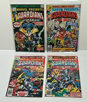 Four bagged and boarded Guardians of the Galaxy comics laid out