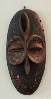 Full view of carved wooden mask