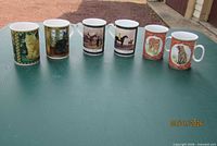 Front view of all six animal-themed mugs lined up