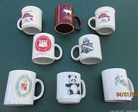 Group shot of all eight mugs, front designs visible
