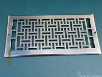 brushed nickel rectangular floor register with geometric pattern