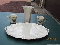 Group shot of Lenox platter, vase, and two mugs