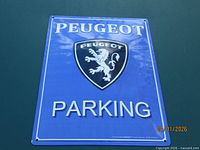 Full front view of Peugeot parking sign