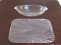 Rectangular Sasaki Emanuel Ungaro tray and oblong ribbed glass bowl on table